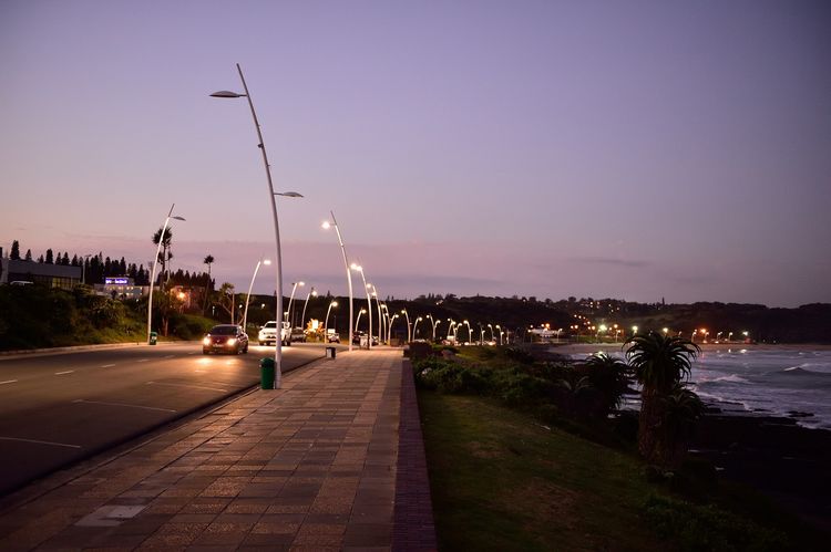 The Esplanade promenade in East London at dusk, beside the sea
